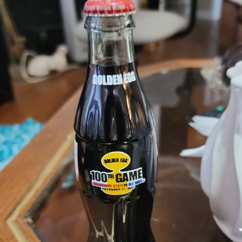 Golden Egg 100th Game Commemorative Black Glass Bottle